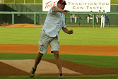 JJ Lehto of the ADT Champion Audi team throws out the first pitch before the Sacramento River Cats game on Tuesday night.