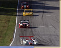 Audi R8 with Emanuele Pirro in his slip stream a BMW M3, a Chevy Corvette followed by a Dodge Viper
