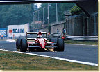 The sparks indicate how close the chassis of a formula 1 car is to the road. Emauele started as 16th again he placed his car in front of his teammate J.J. Lehto, who qualified 20th. Emanuele finished his home Grand Prix in 10th position.