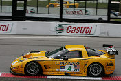 The #4 Corvette reflects while driving down the Mosport  frontstretch