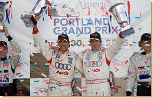 Emanuele Pirro and Frank Biela celebrate their second ALMS win in a row