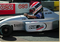 Eamuele Pirro coaching Chris during a Kart race at part of the Monaco GP circuit