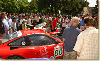 Fans take a close look at the #80 Prodrive Ferrari 550 Maranello s/n 113136 and the #31 White Lightning-Petersen Motorsports Porsche 911 GT3 RS