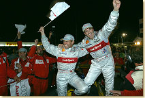 Tom Kristensen and Rinaldo Capello celebrate the ALMS title