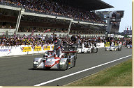 Emanuele Pirro celebrates his third consecutive win at Le Mans