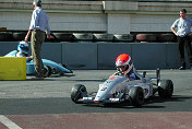 Eamuele Pirro coaching Chris during a Kart race at part of the Monaco GP circuit