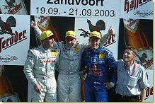 Mattias Ekström (second from right) celebrates third place