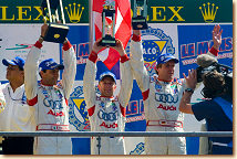 Emanuele Pirro, Allan McNish and Frank Biela on the podium at Le Mans